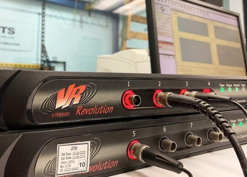 A close-up of two VR9500 controllers stacked, with various cable connections.